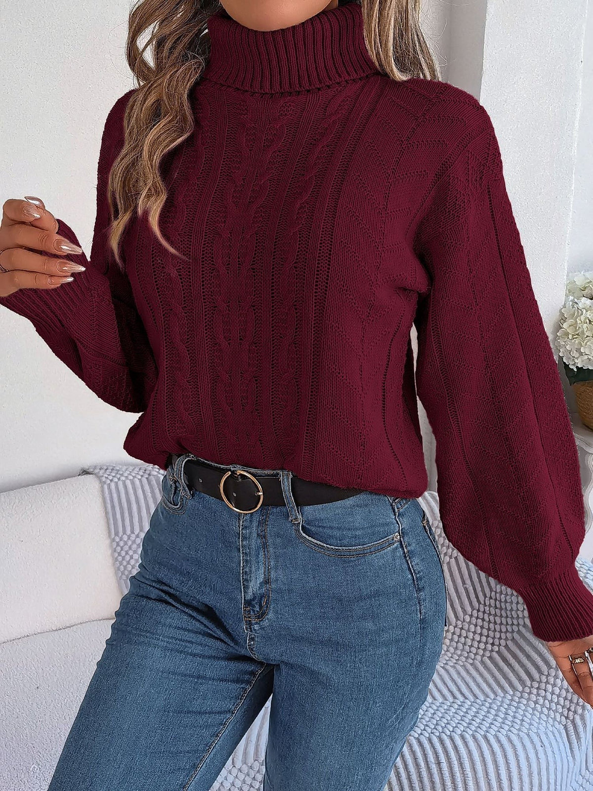 Cable-knit roll neck jumper