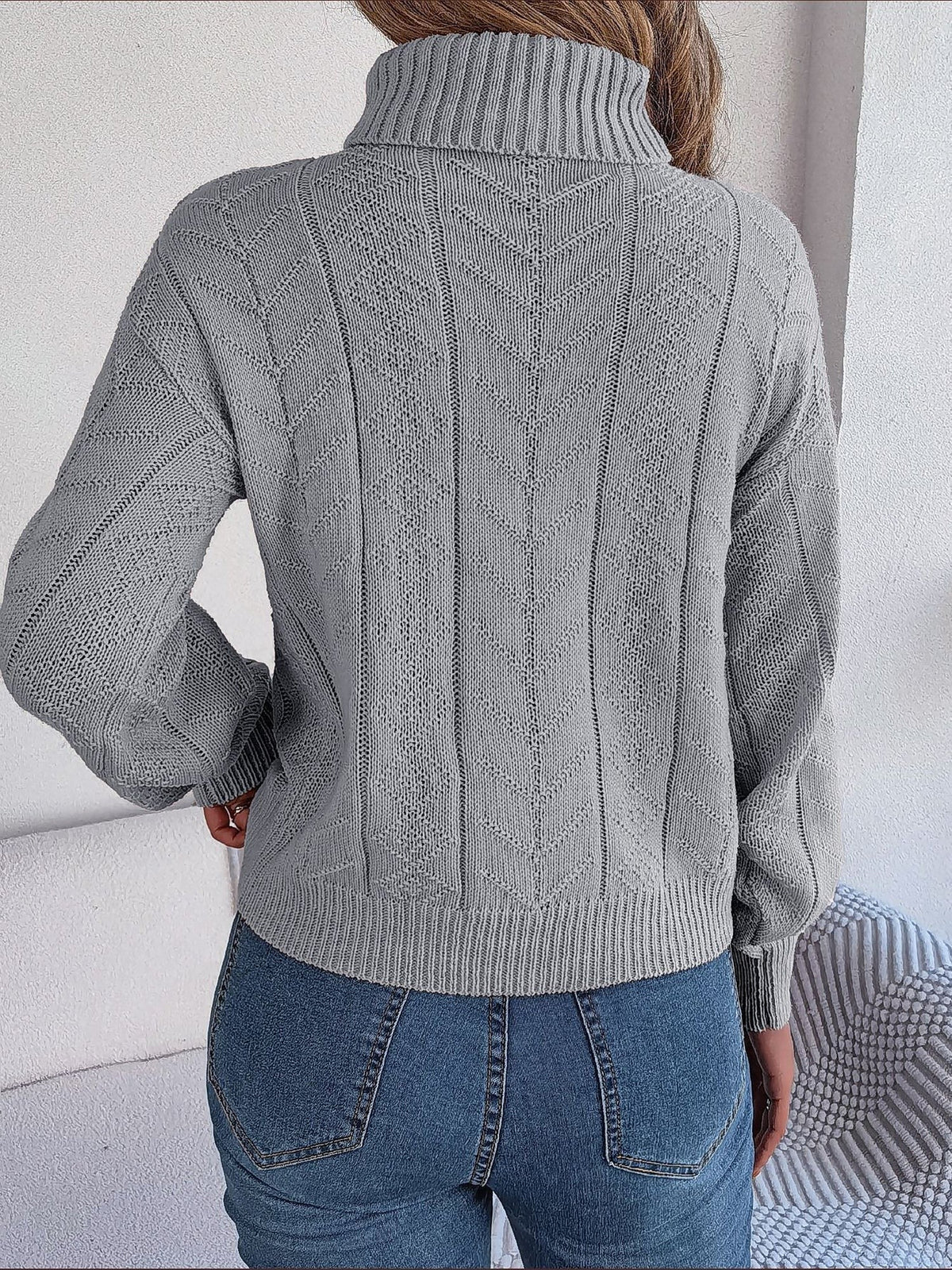 Cable-knit roll neck jumper