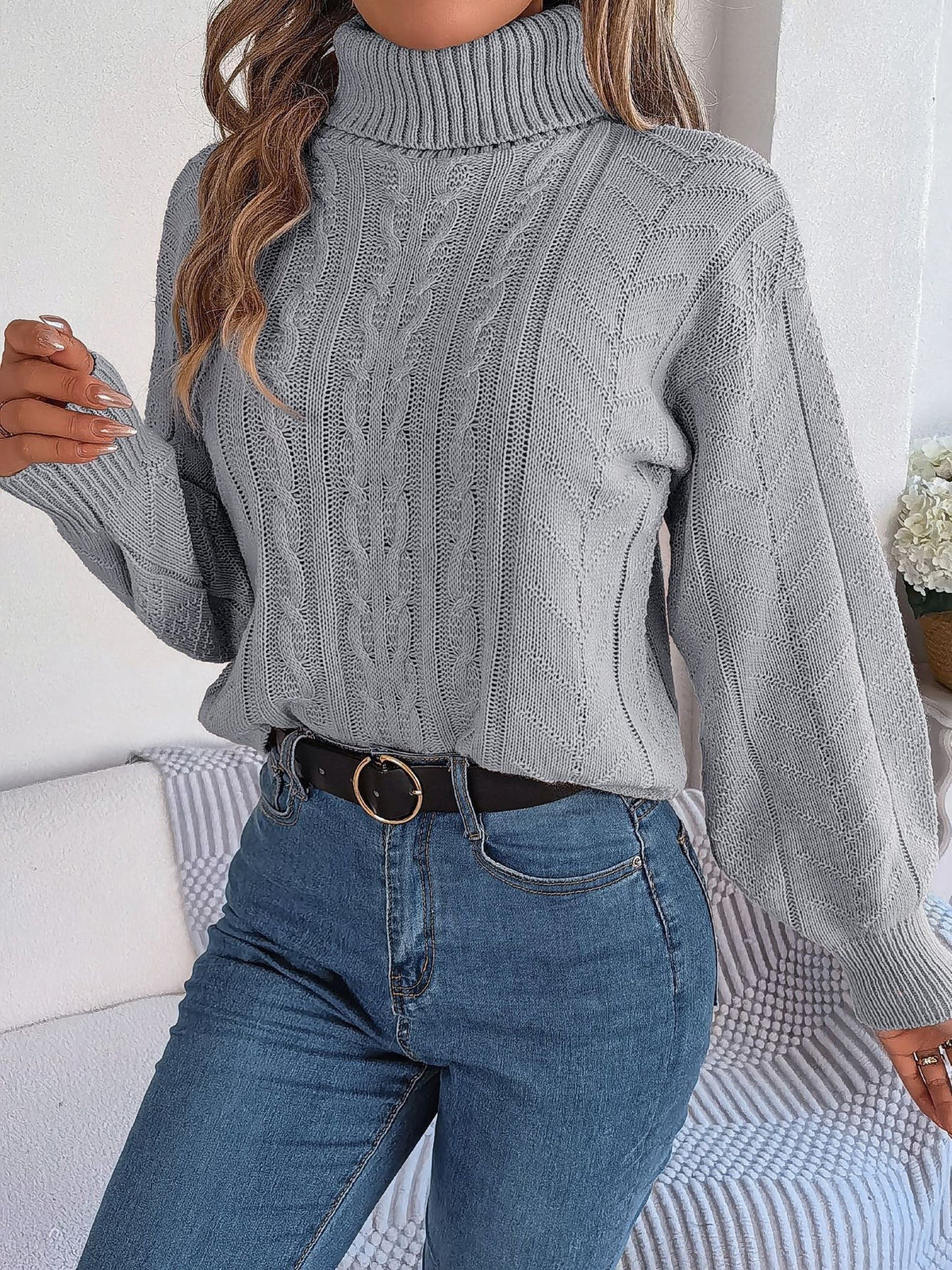 Cable-knit roll neck jumper