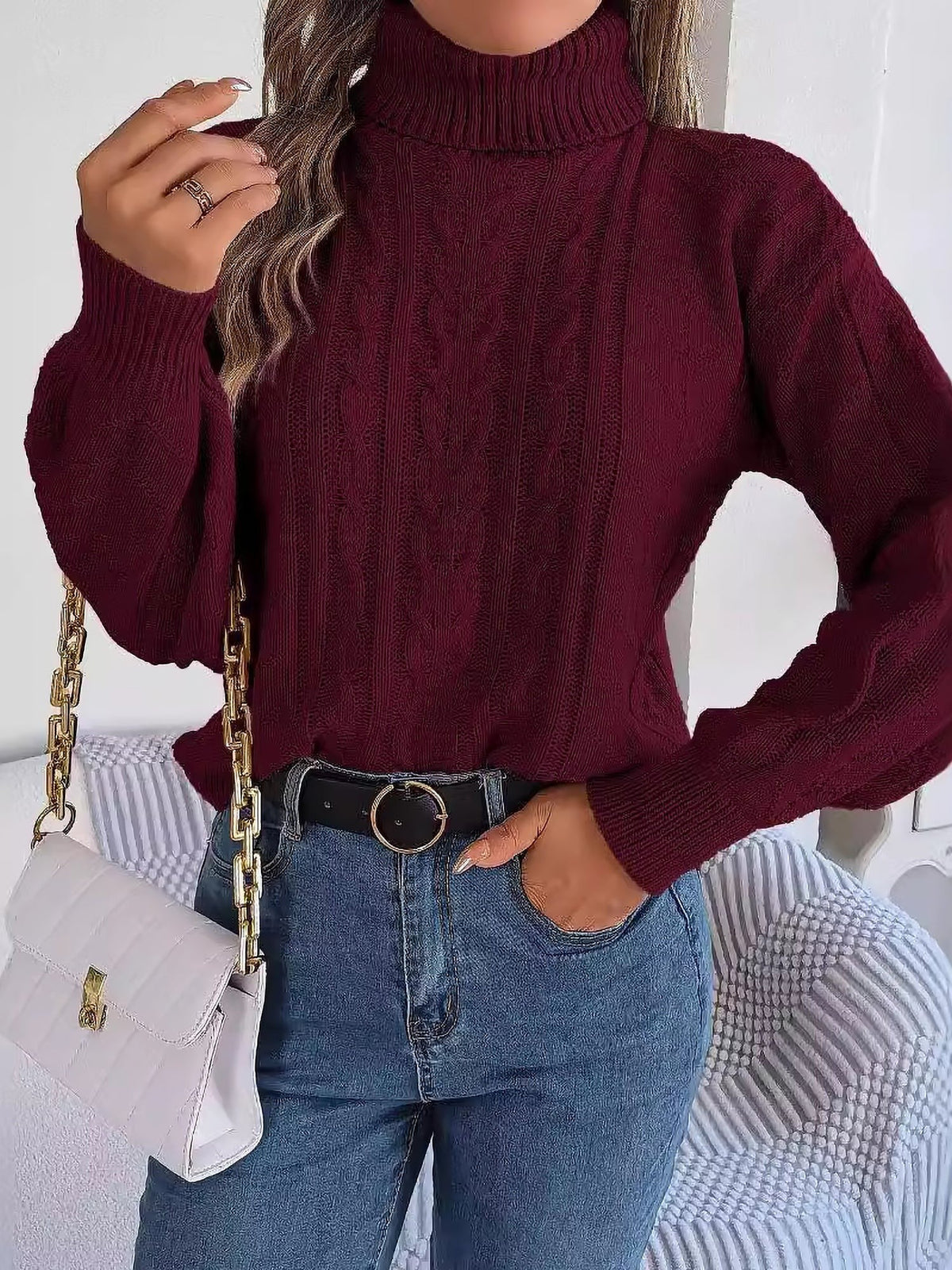 Cable-knit roll neck jumper