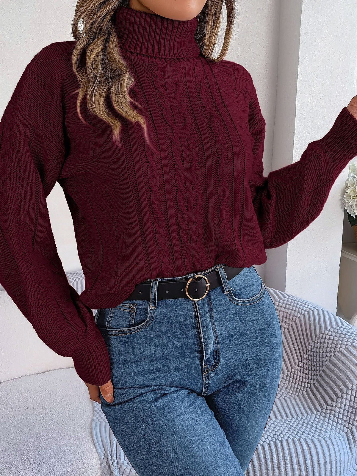 Cable-knit roll neck jumper