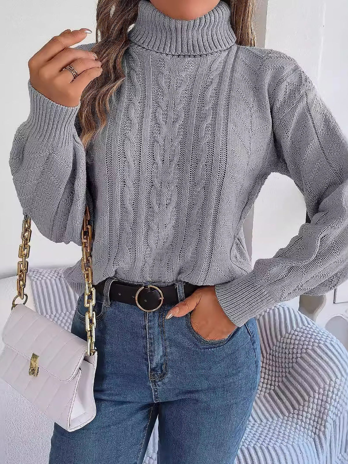 Cable-knit roll neck jumper